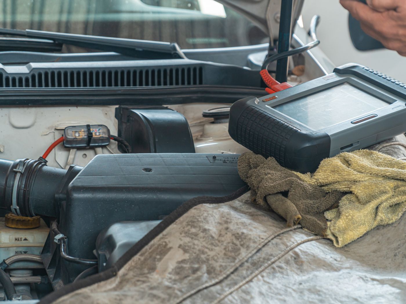 Diagnostic tool plugged into a car